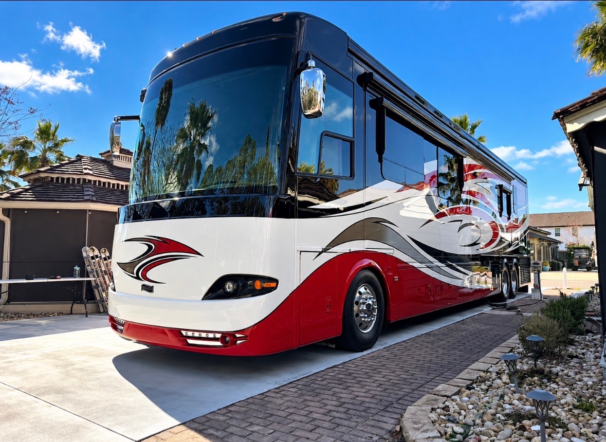Red and white Class A motorhome gleaming after an Ace detail